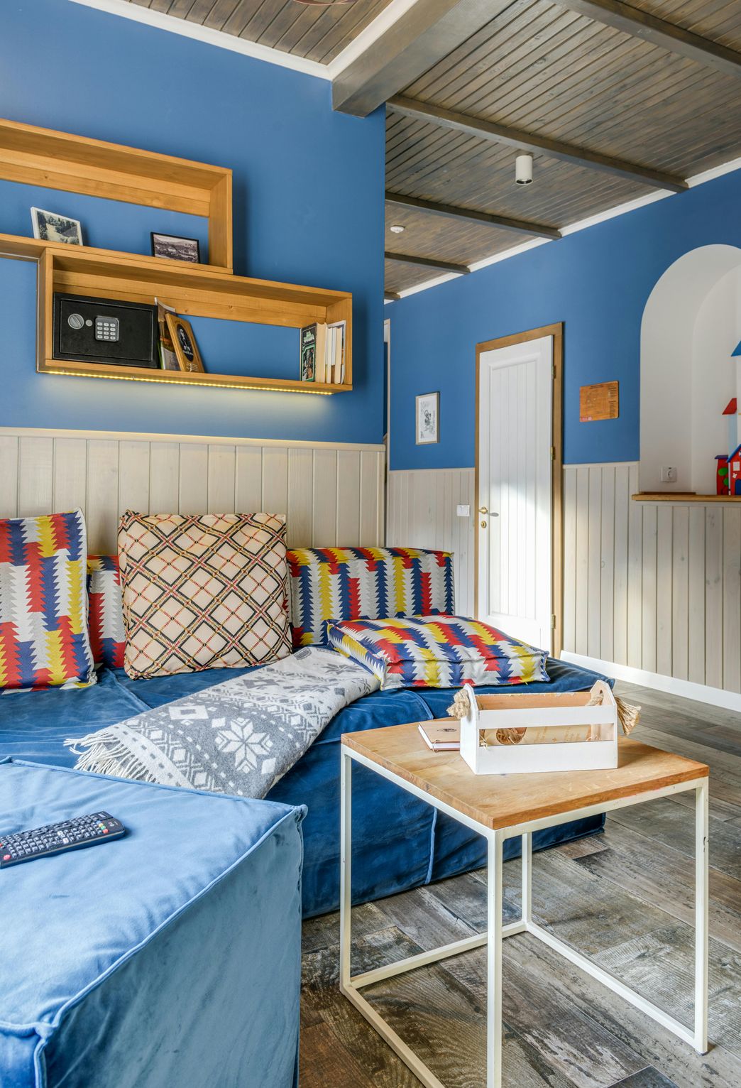 Walls painted navy blue in bedroom