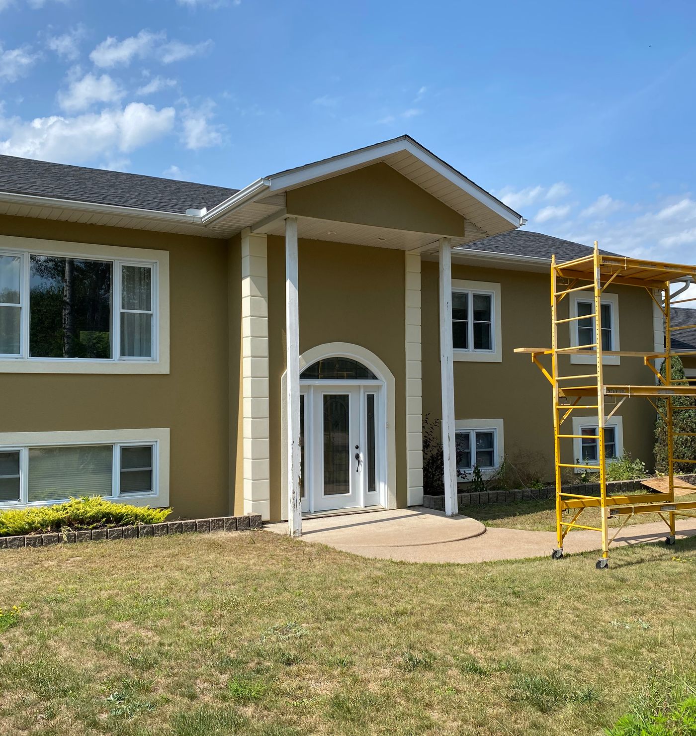 Exterior of house being painted