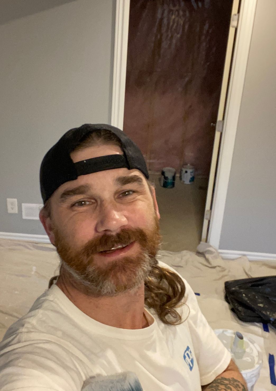 John sitting beside his supplies